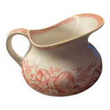Old pitcher in red-decorated earthenware.