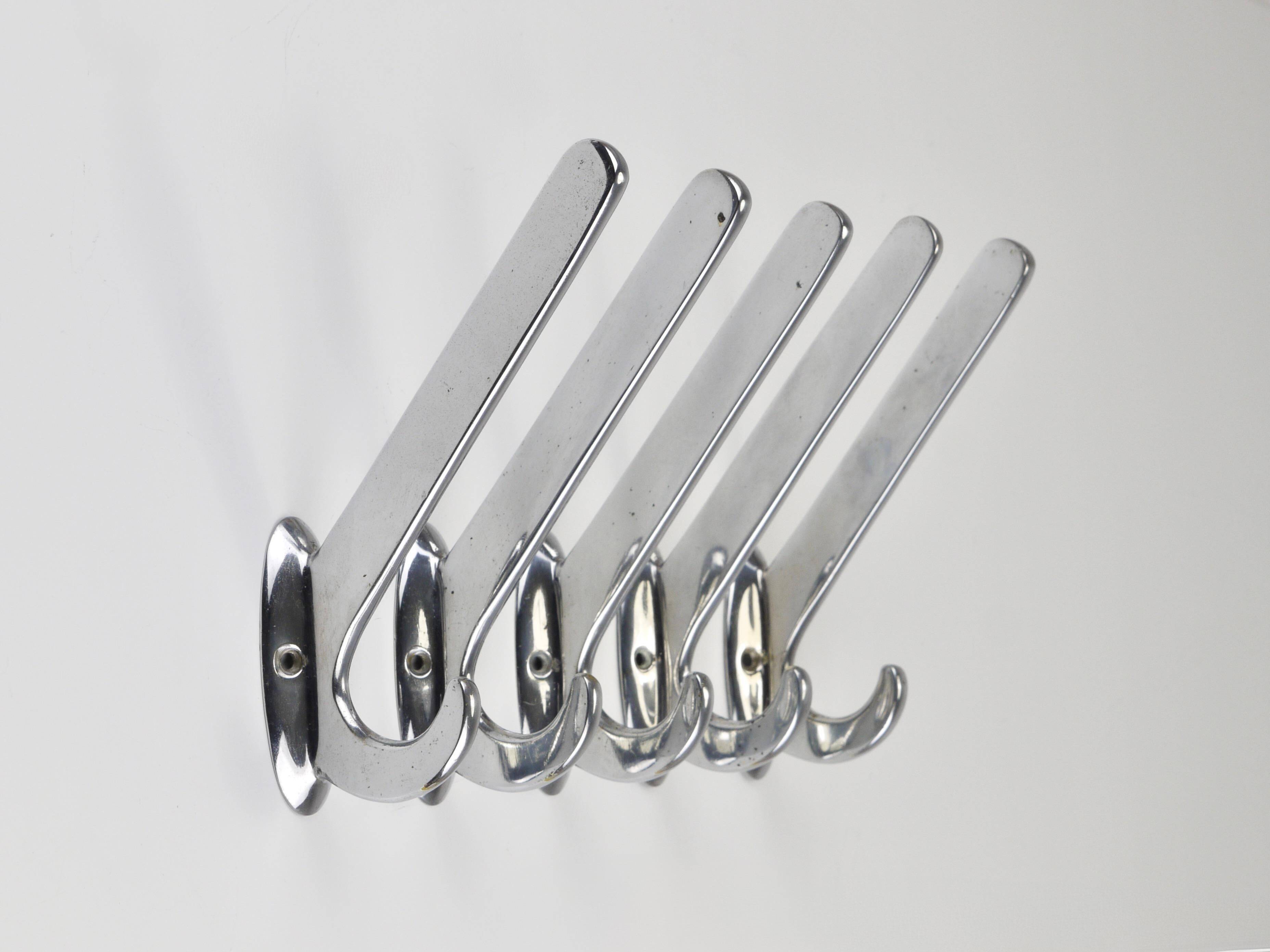Up to 5 large Art Deco Bauhaus wall hooks in nickel and brass, Vienna, 1930s.