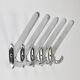 Up to 5 large Art Deco Bauhaus wall hooks in nickel and brass, Vienna, 1930s.