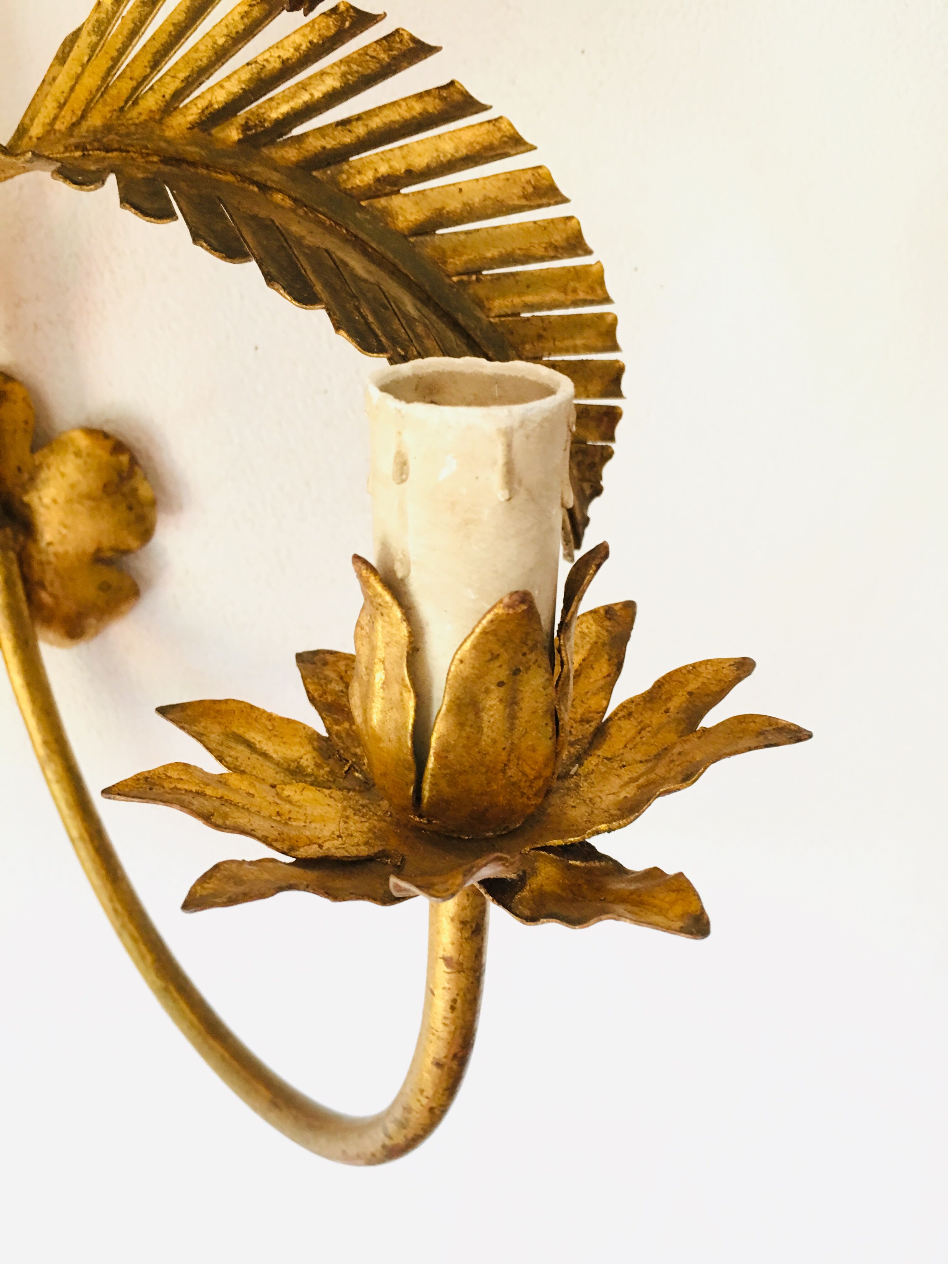 Golden palm leaf sconce