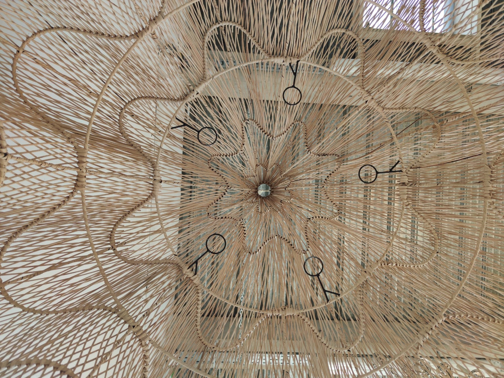 Huge rattan suspension in the shape of a corolla H:1m; D: 1m50