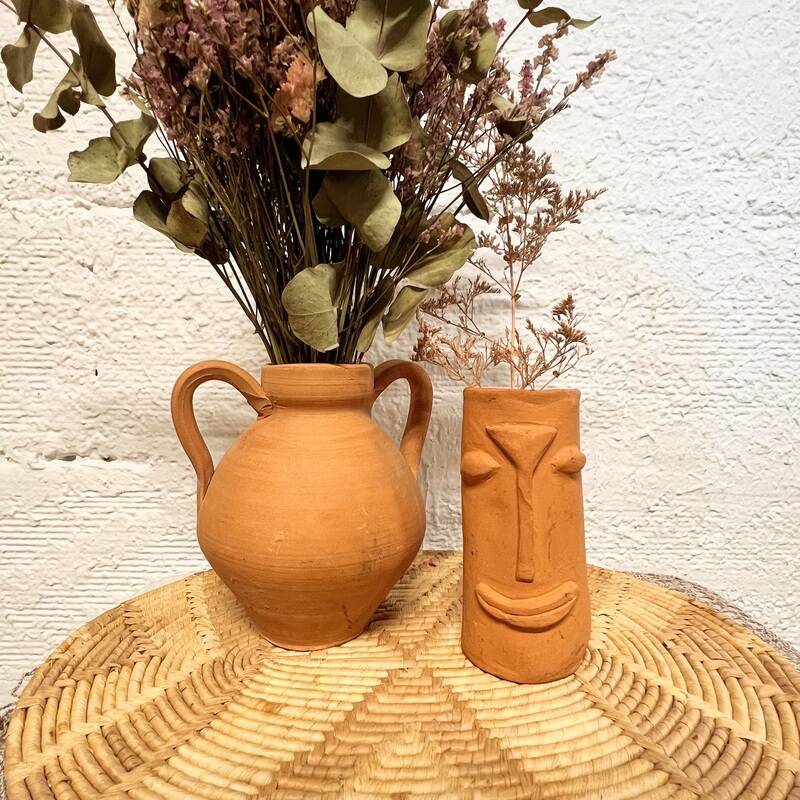 Face terracotta vase