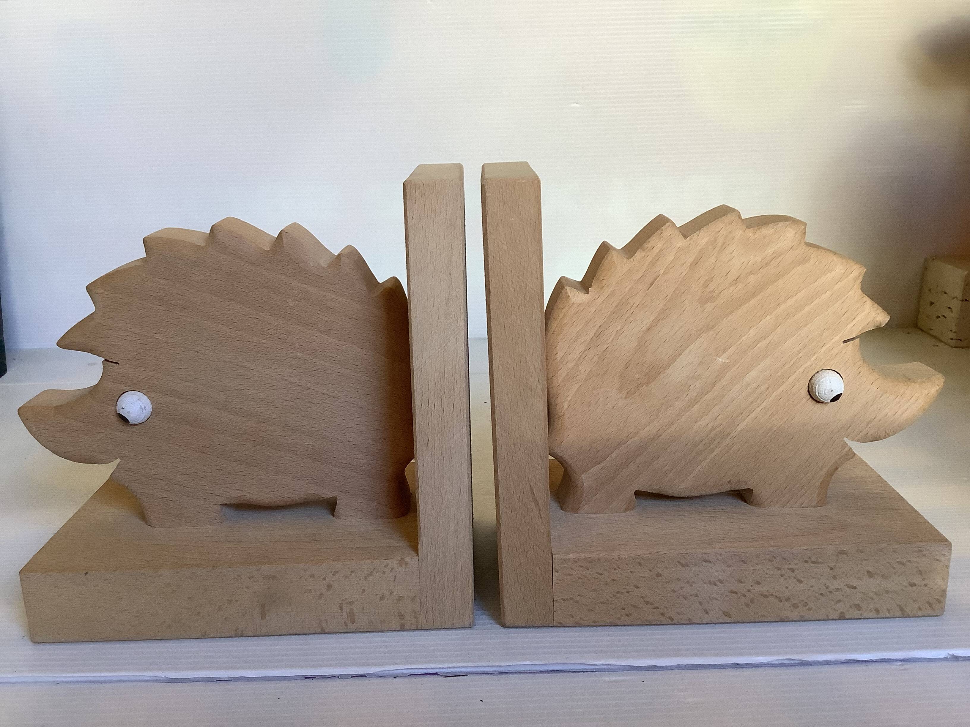 Pair of wooden hedgehog bookends