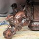 Hunting style dining table with figures of four different animals.