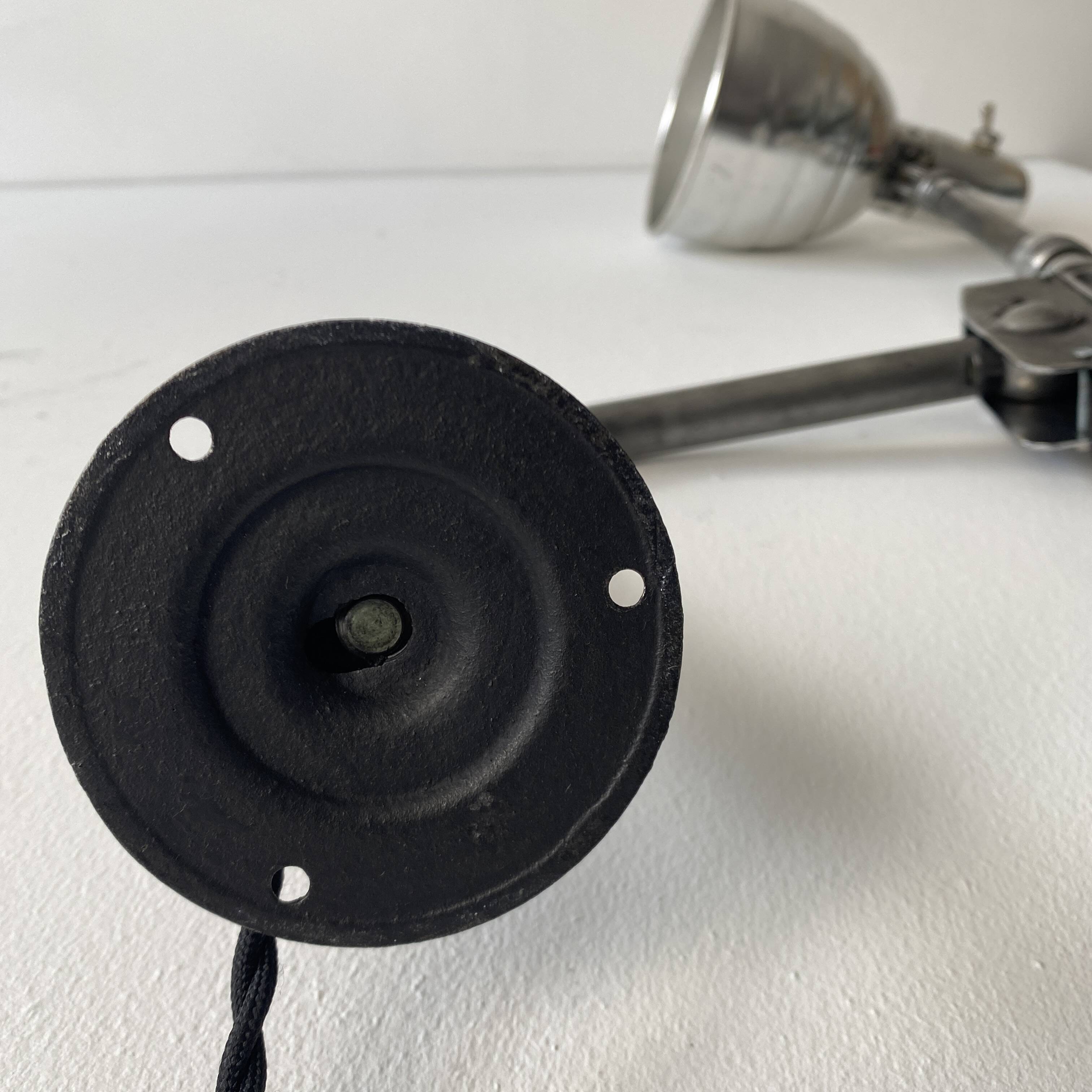 Old industrial wall light with counterweight.