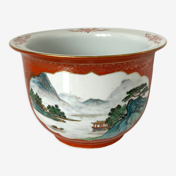 Chinese planter or Chinese porcelain pot cover decorated with landscapes on a coral and golden background