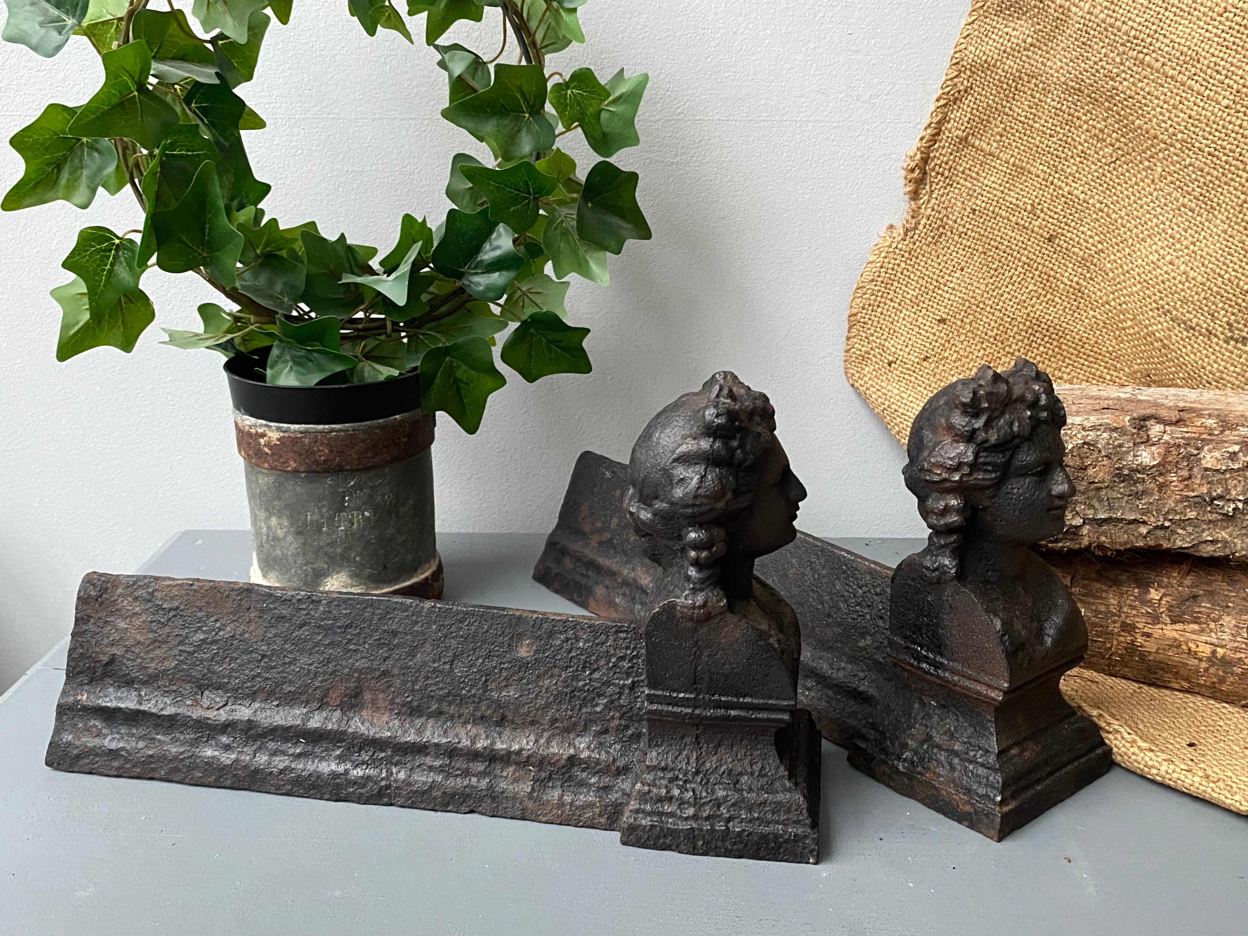 Pair of cast iron pegs