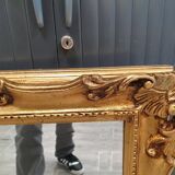 Beveled mirror and golden wood