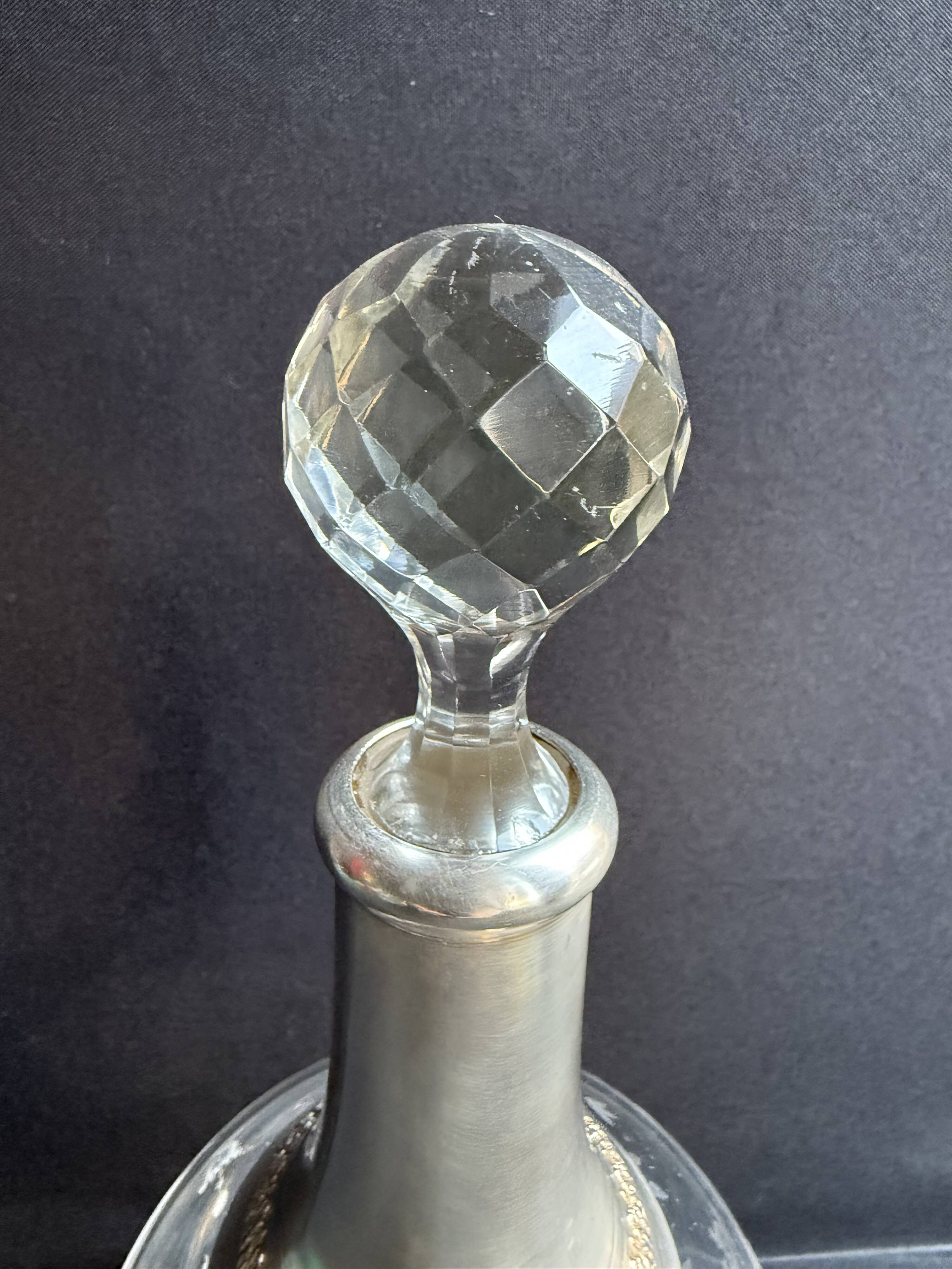 Cut crystal carafe with silver frame