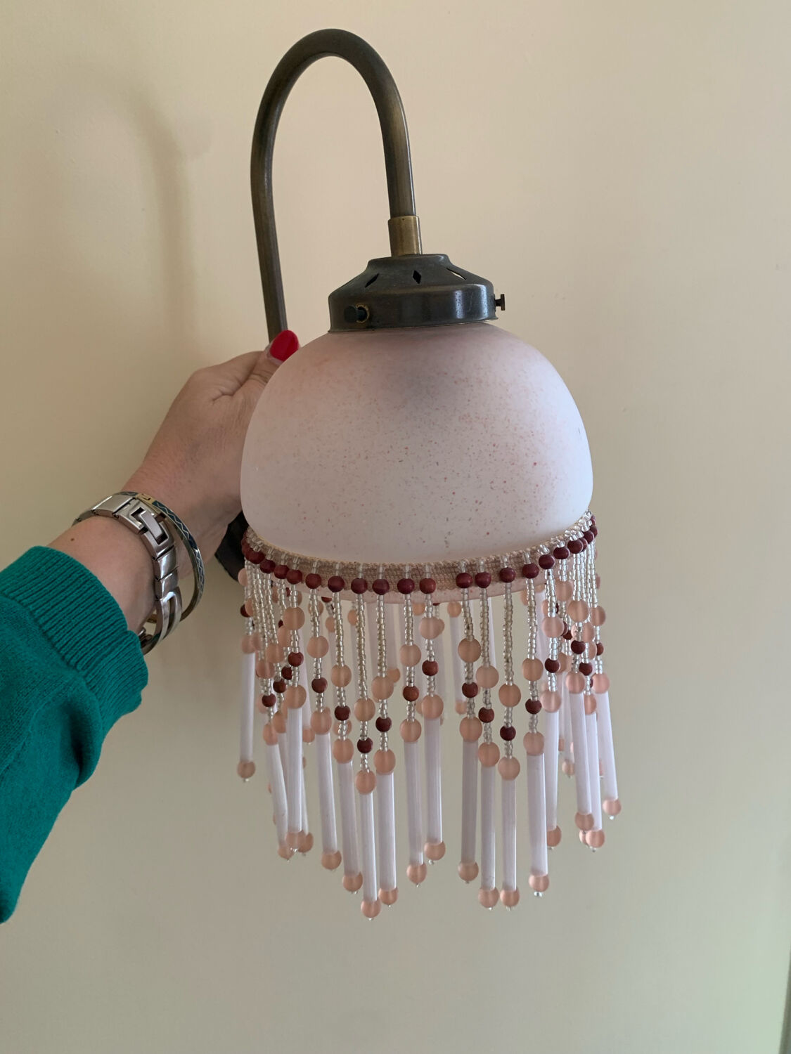 Pair of wall sconces in pink glass and pendants.