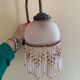 Paire d’appliques murales en verre rose et pampilles