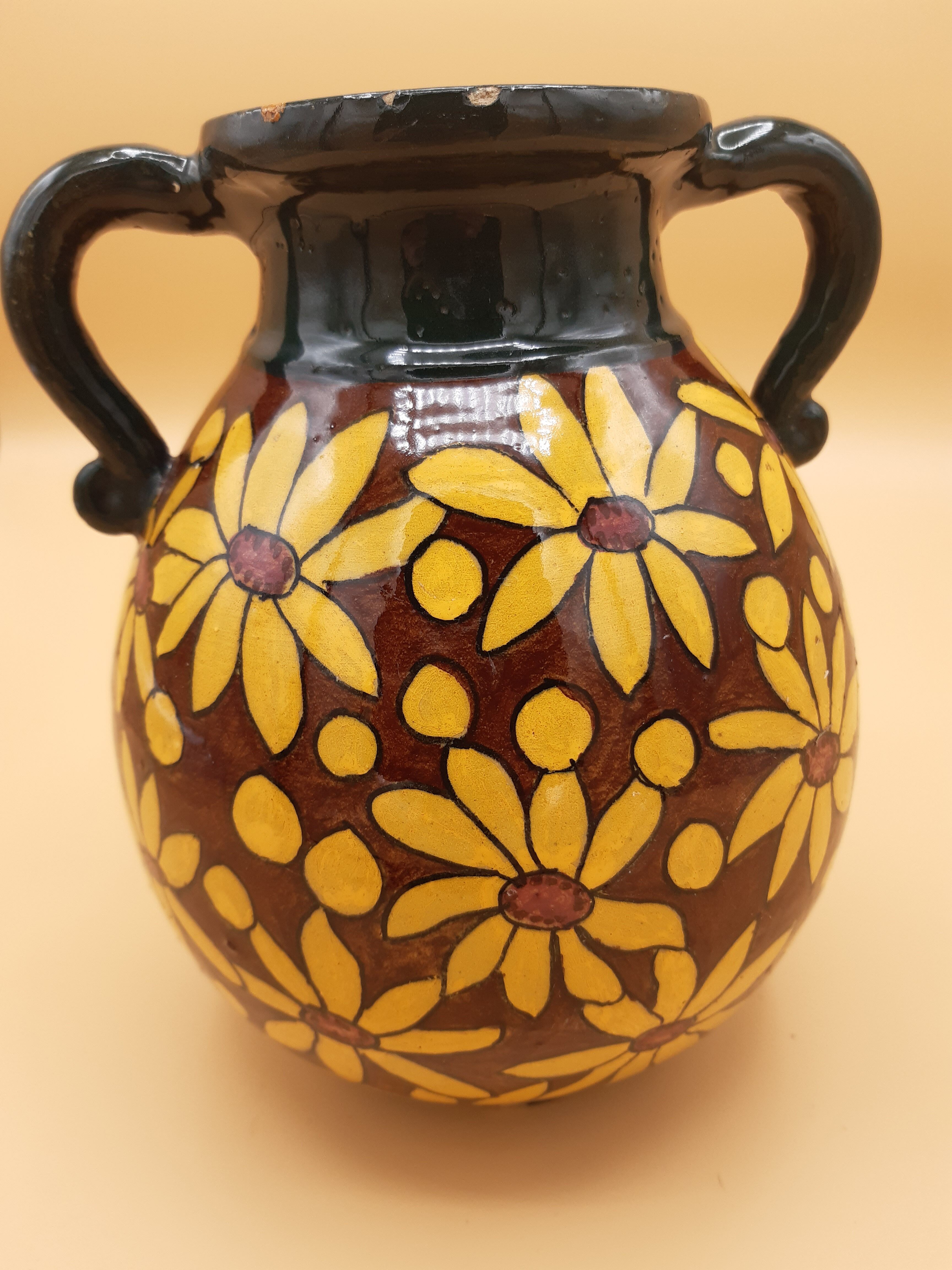 Brown and yellow daisy ceramic vase