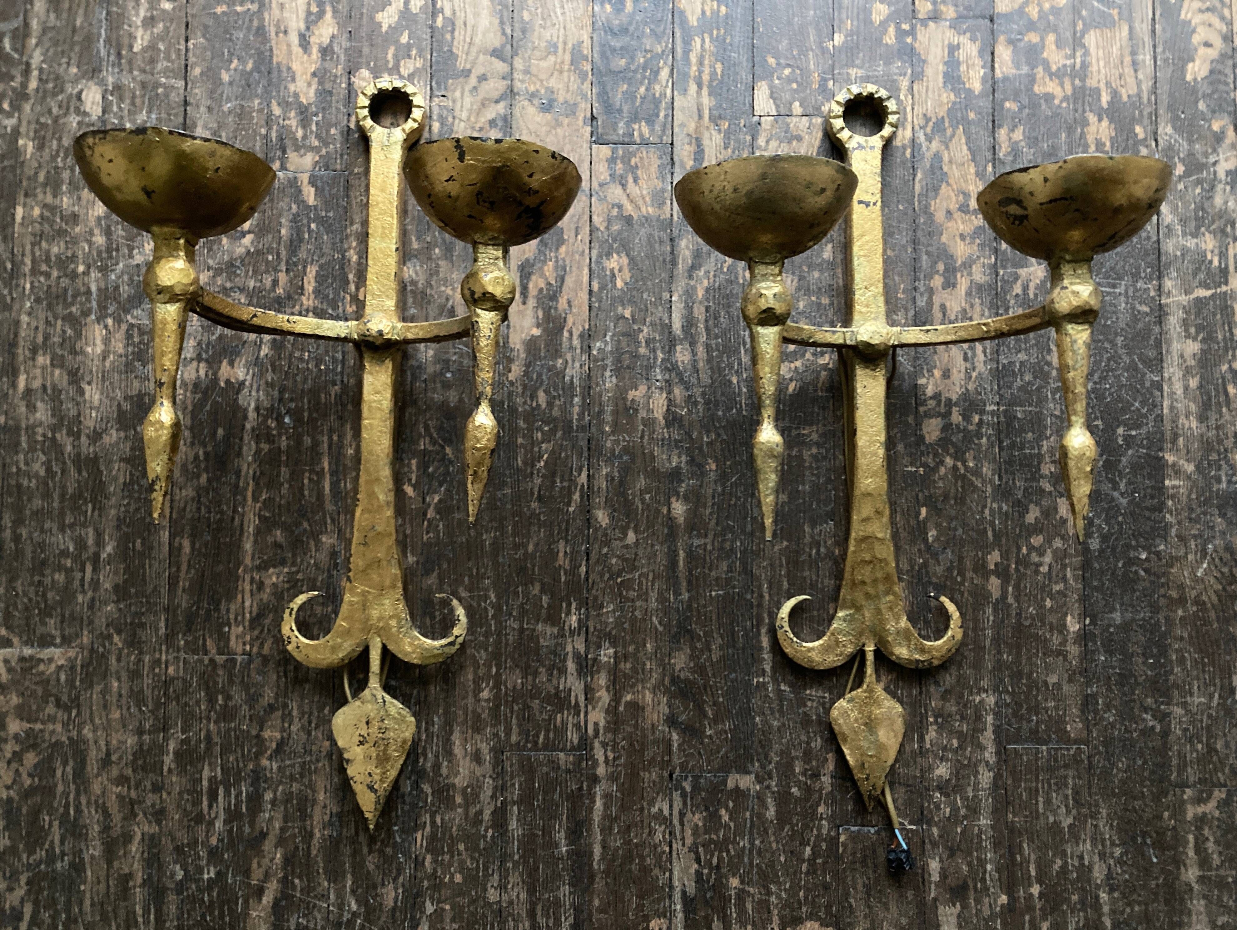 Pair of XXL torchlight sconces in golden beaten iron Italian work 1960
