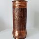 Vintage brutalist umbrella stand in hammered copper with a wood effect.