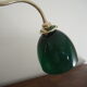 Desk lamp in brass with a swan neck and green opaline glass.