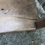 Duo of old solid oak benches with backs and armrests.