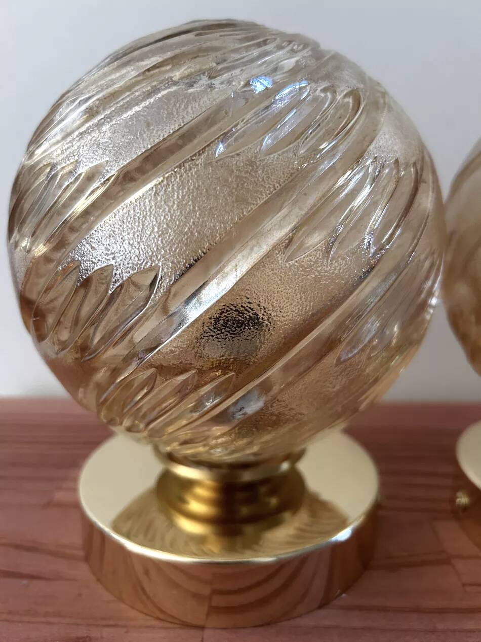 Pair of golden globe wall lights