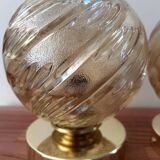 Pair of golden globe wall lights