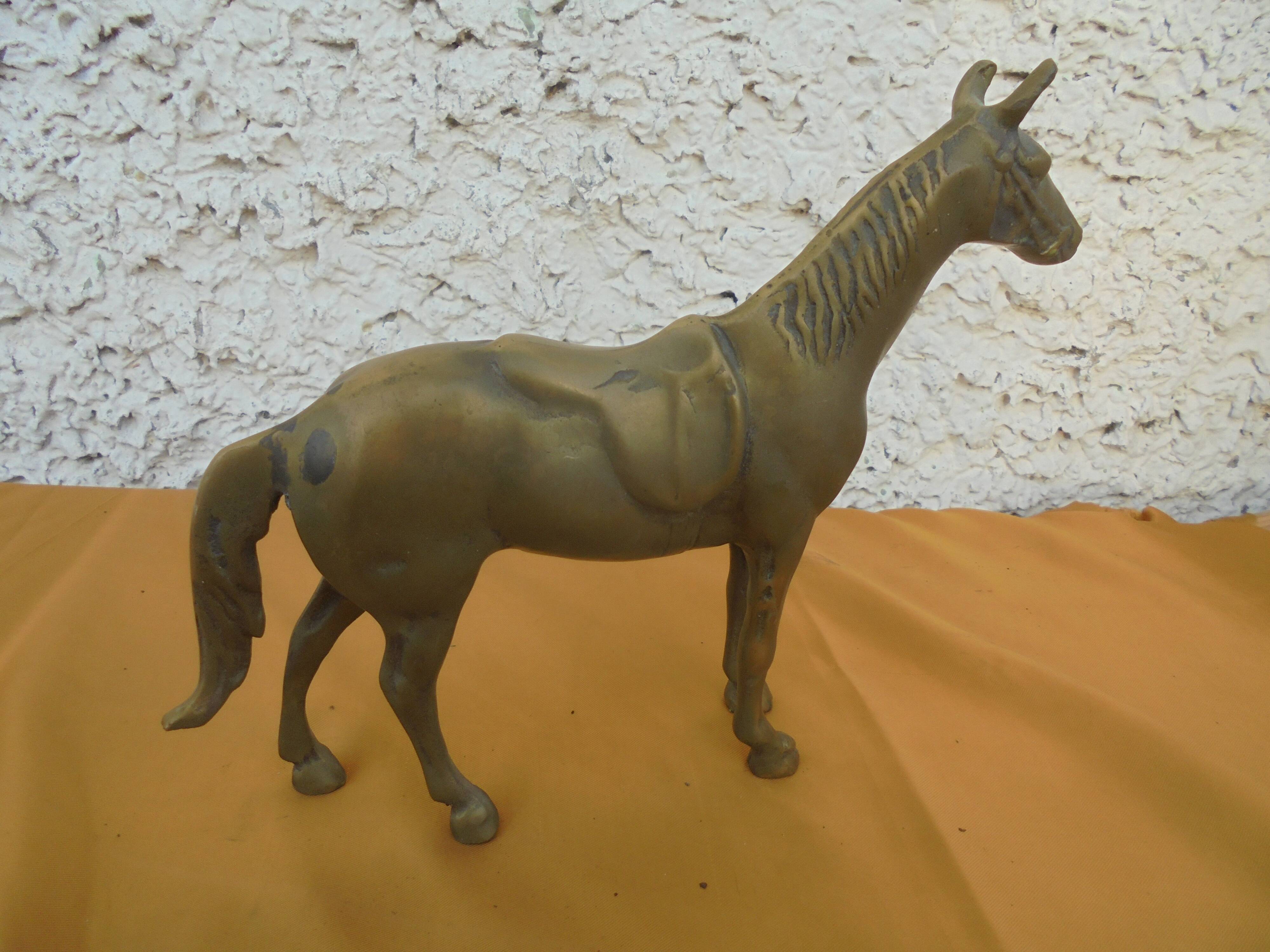 Brass saddled horse