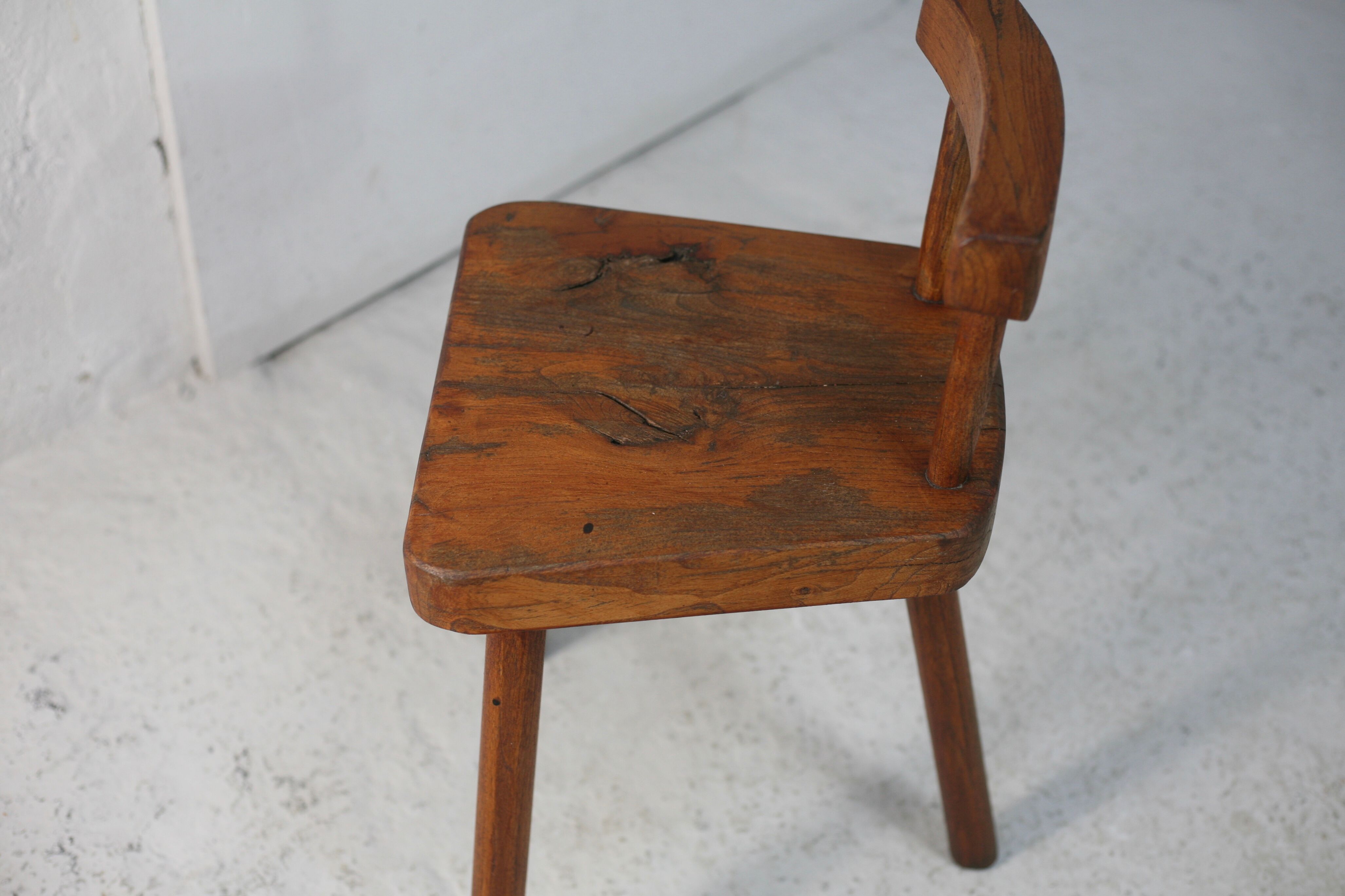 Pair of tripod stools with brutalist backrests, France, circa 1960