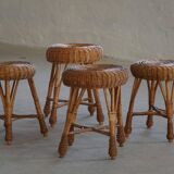 A set of 4 vintage Scandinavian rattan stools, in the style of Tony Paul, from the 1960s.