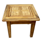 Coffee table on old parquet floor with marquetry