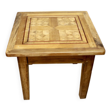 Coffee table on old parquet floor with marquetry