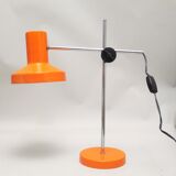 Orange articulated desk lamp from the 1970s