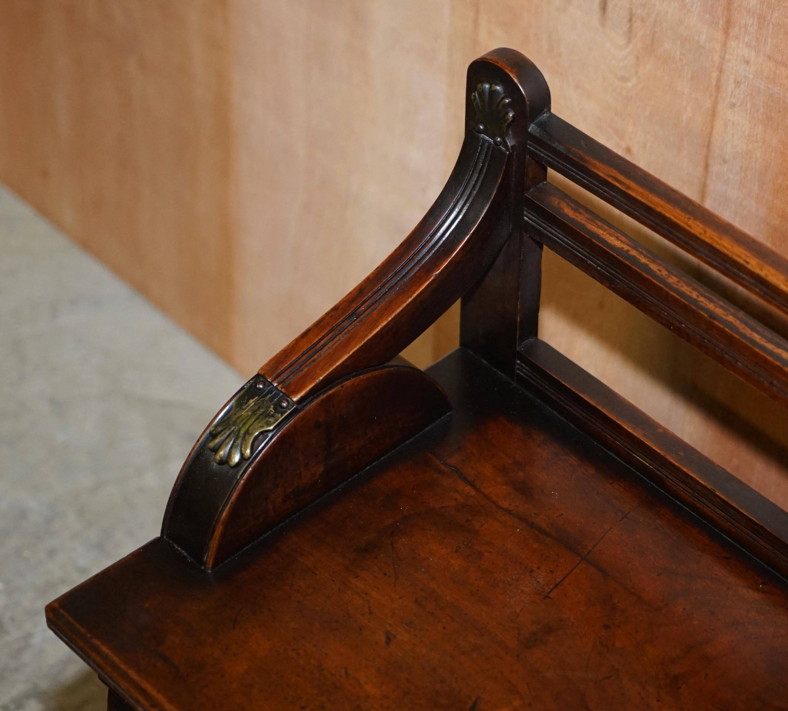 Antique entrance bench by Jas Shoolbred with brass fittings and walnut frame circa 1890.