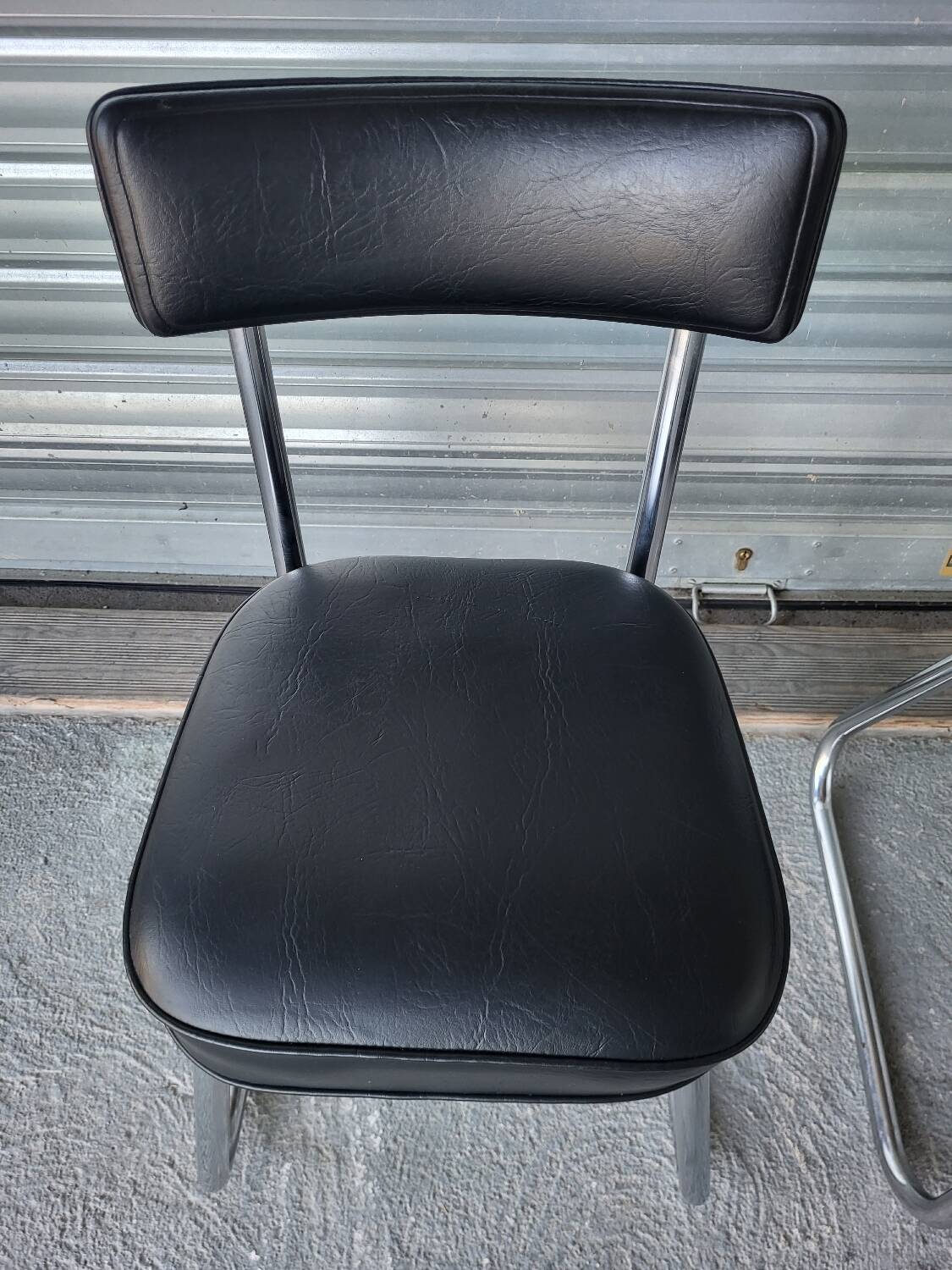Pair of vintage black and chrome leatherette office chairs in very good condition