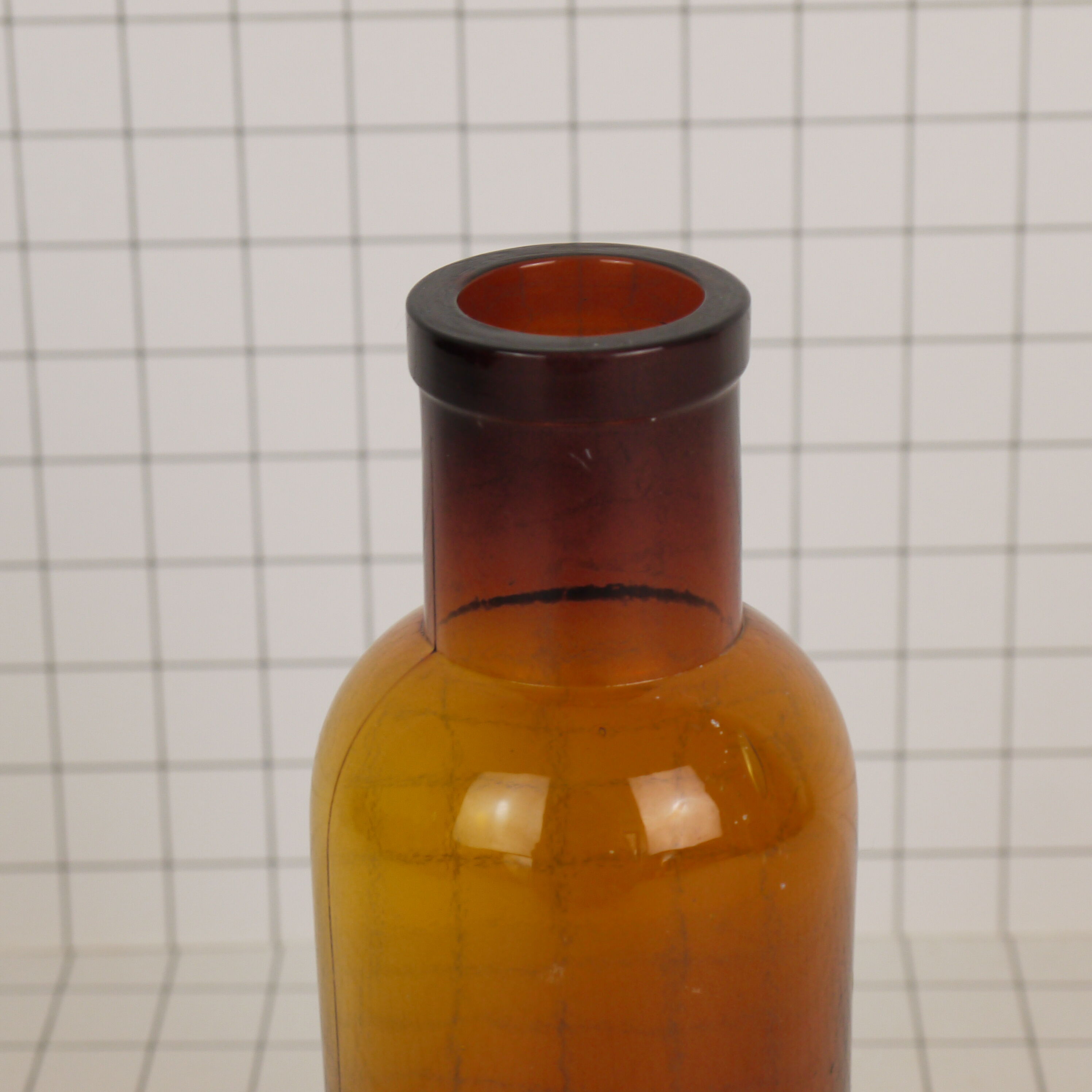 Rummaging in brown glass bottle