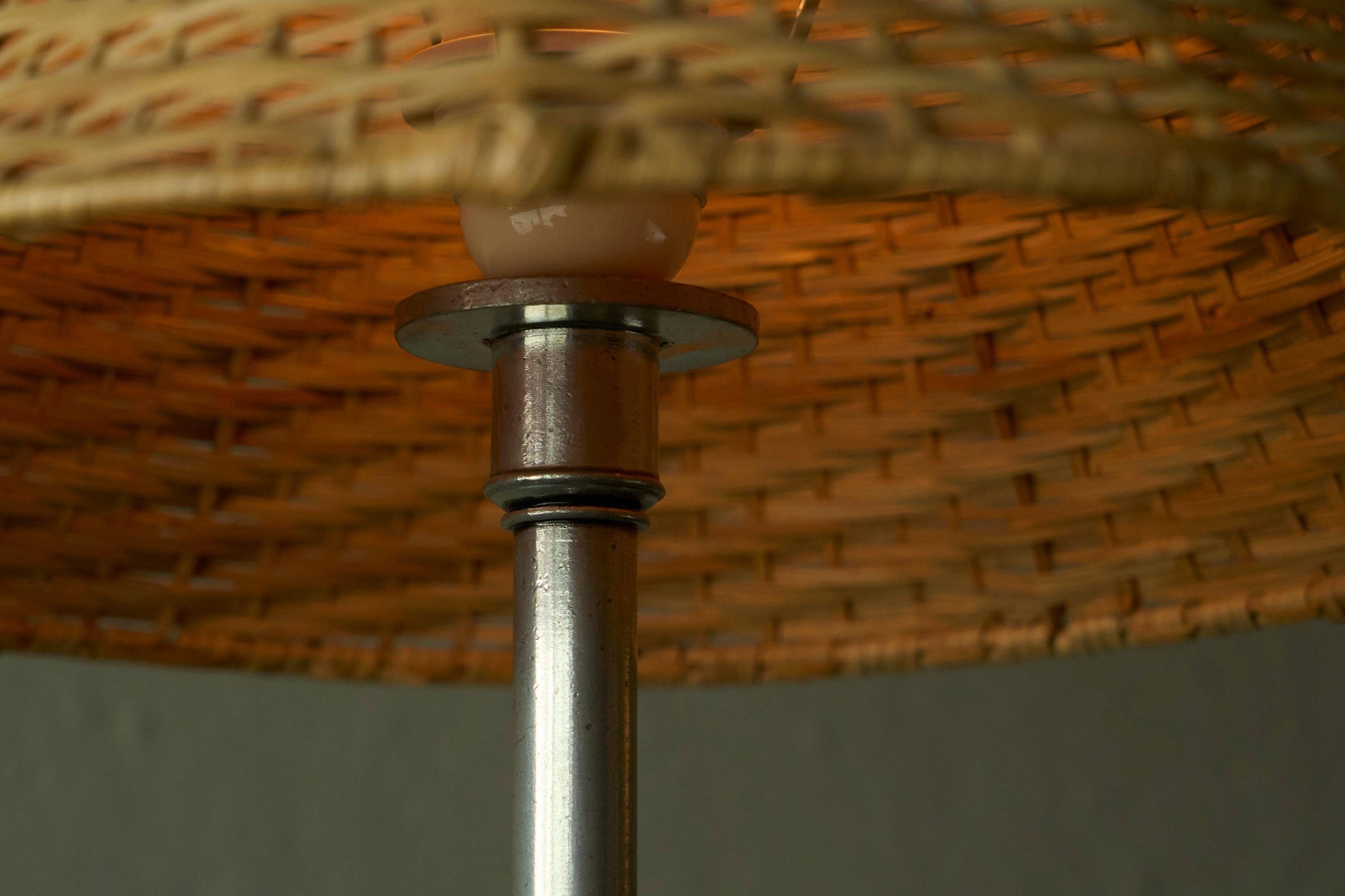 Grace table lamp in tin with rattan shade, 1930s