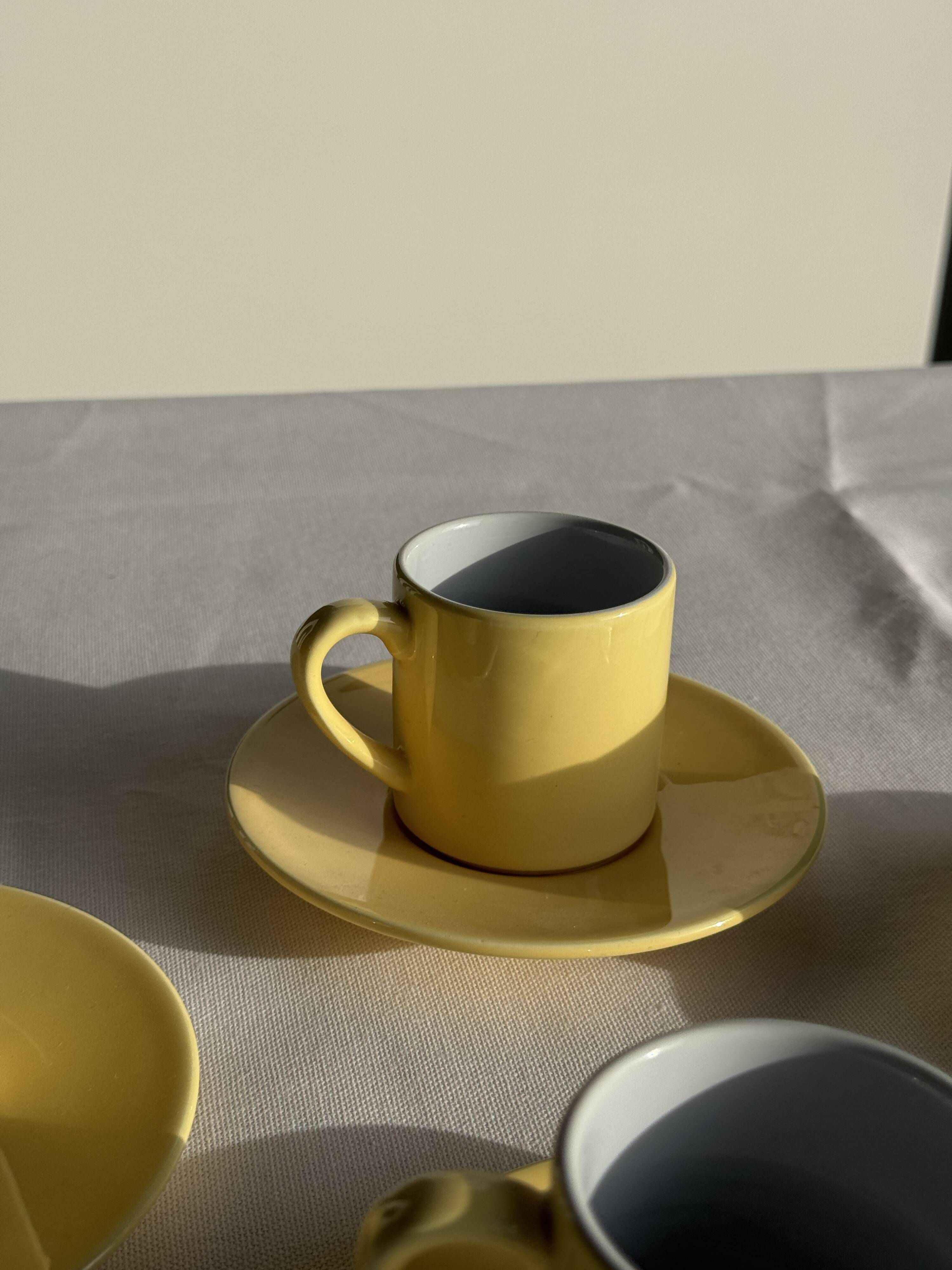 Set of 4 vintage yellow Italian espresso cups and saucers.