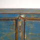 Old wooden entrance buffet in blue and yellow tones (circa 1920).