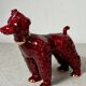 Chien en céramique bordeaux et doré