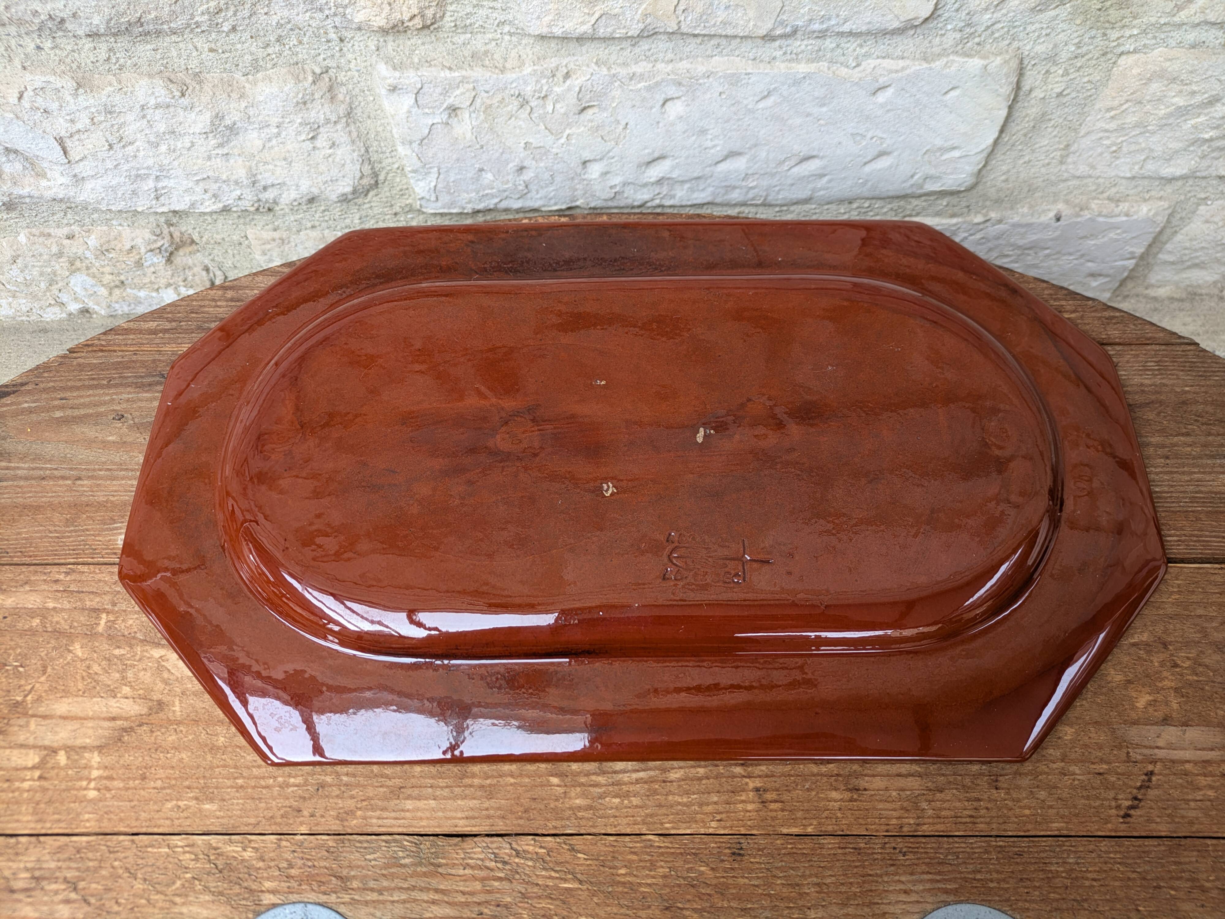 Rectangular earthenware dish with a glazed finish, decorated with a bouquet of flowers.
