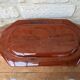 Rectangular earthenware dish with a glazed finish, decorated with a bouquet of flowers.