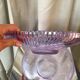Twisted glass fruit cup of purplish pink color