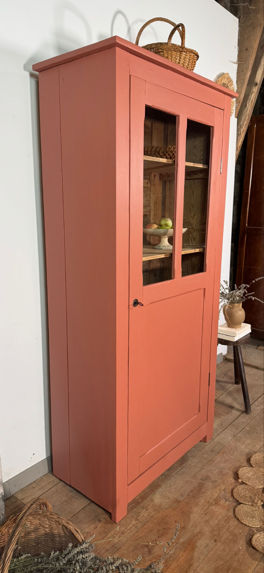 Antique glass-fronted terracotta cupboard