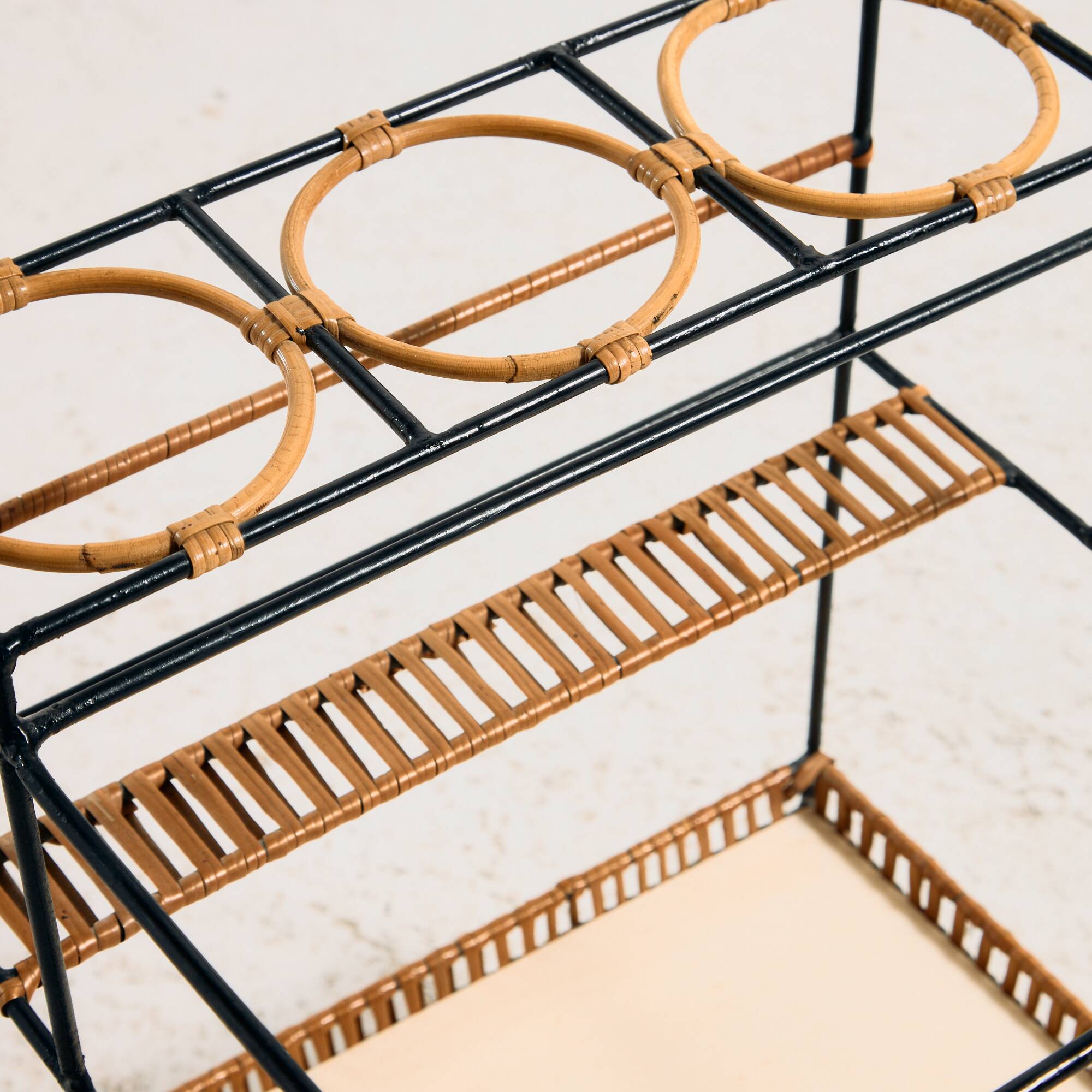 Metal cart with bamboo and wicker details.