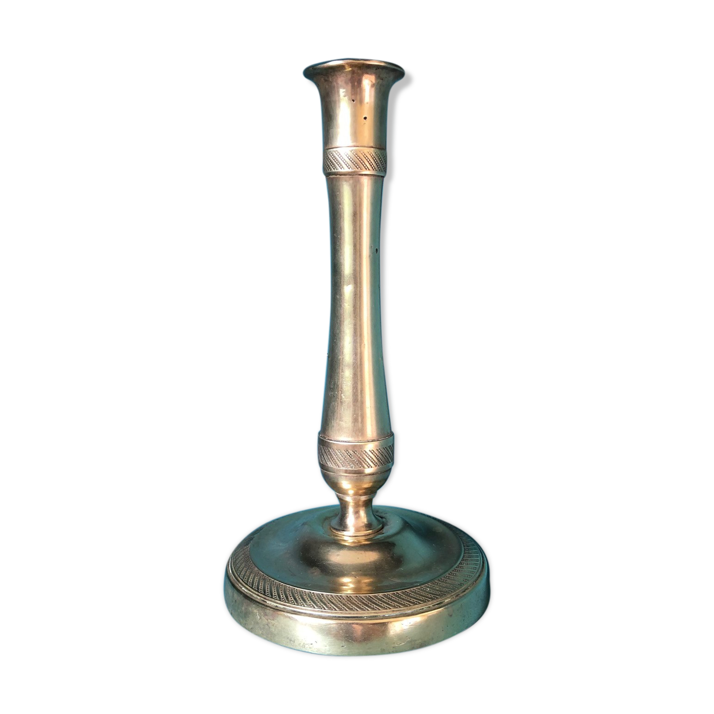 Large candlestick in chiseled brass