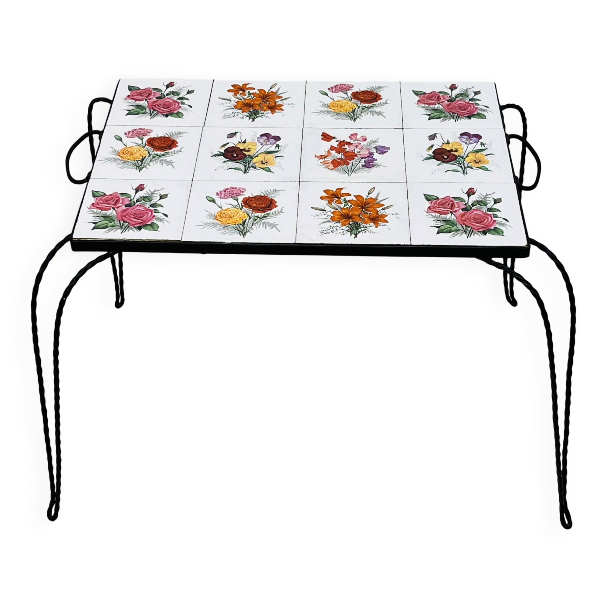 Vintage coffee table in wrought iron with floral tiles.