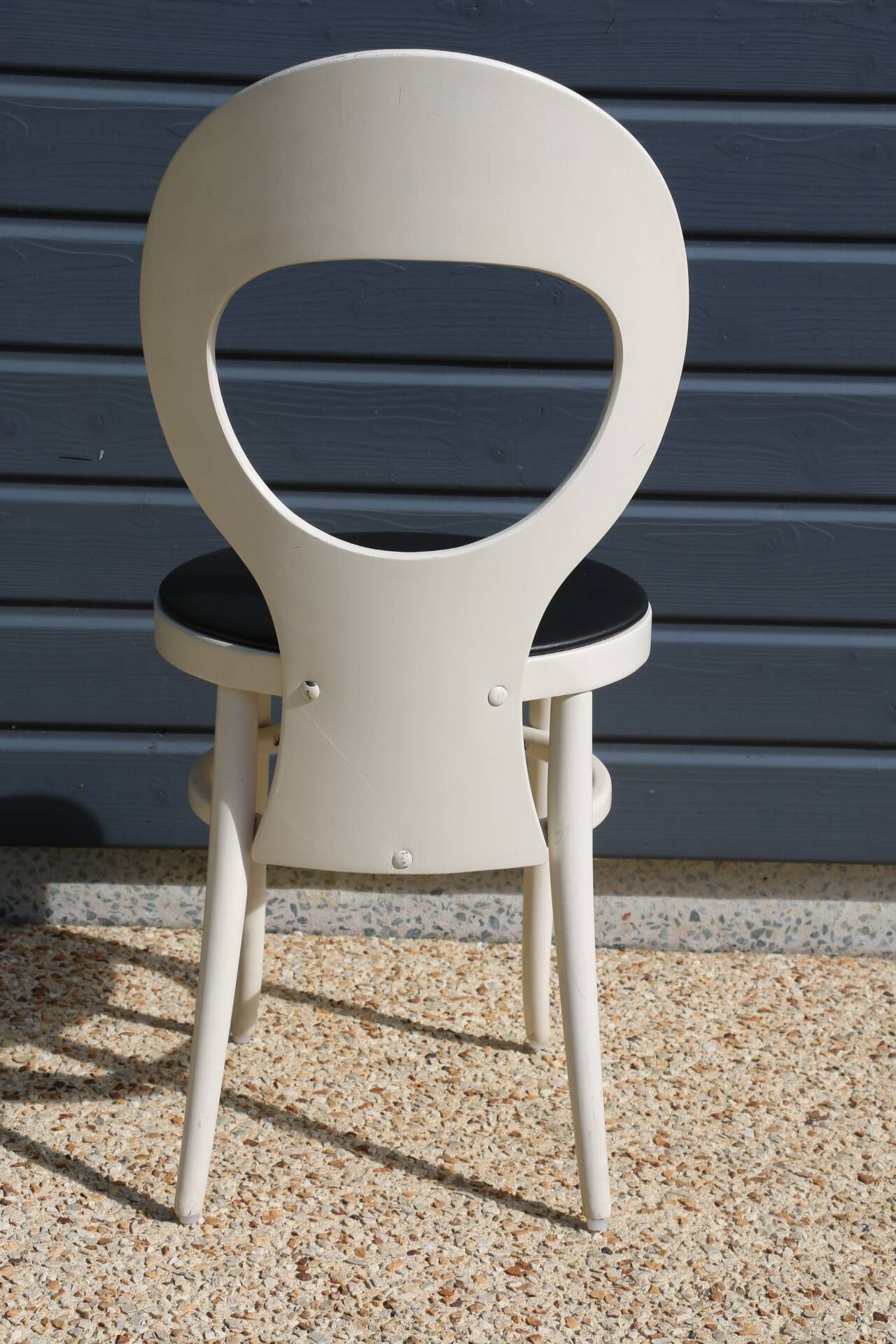6 baumann chairs, white gull with black faux leather.