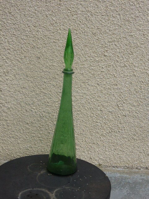 Vintage green faceted glass bottle with its cap 1970