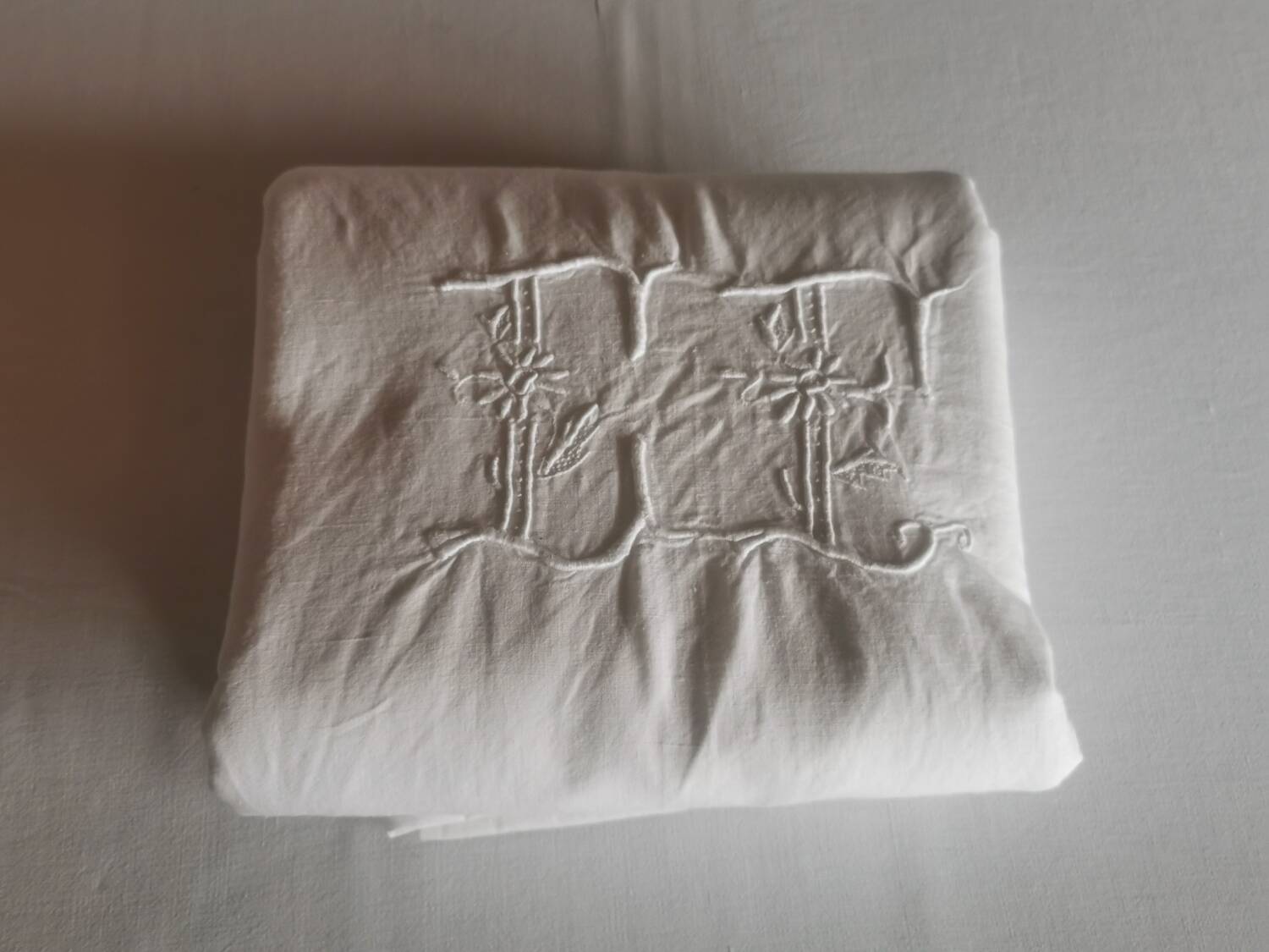 Old large monogrammed sheet hand-embroidered.