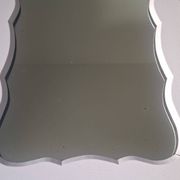 Mid-20th century rectangular wall mirror with a powder pink frame.