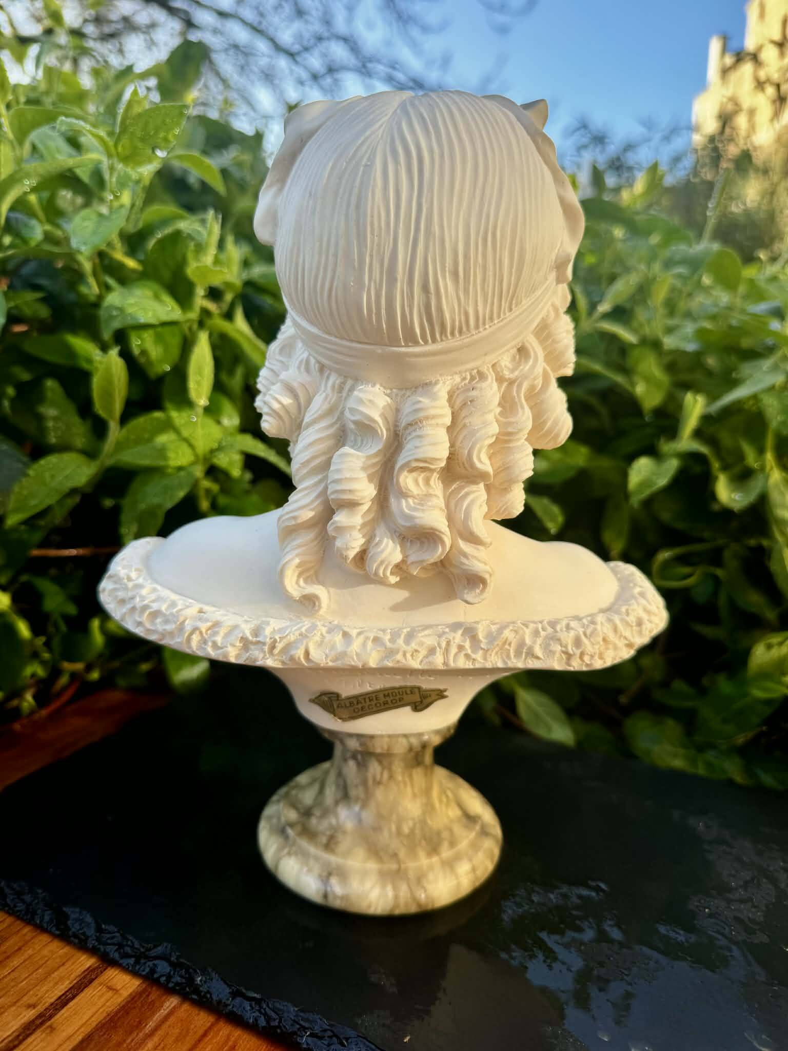 Bust of a woman signed Arnaldo Giannelli dated 1972.