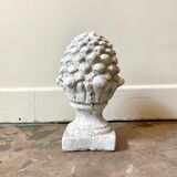 Ornamental pine cone in bleached concrete
