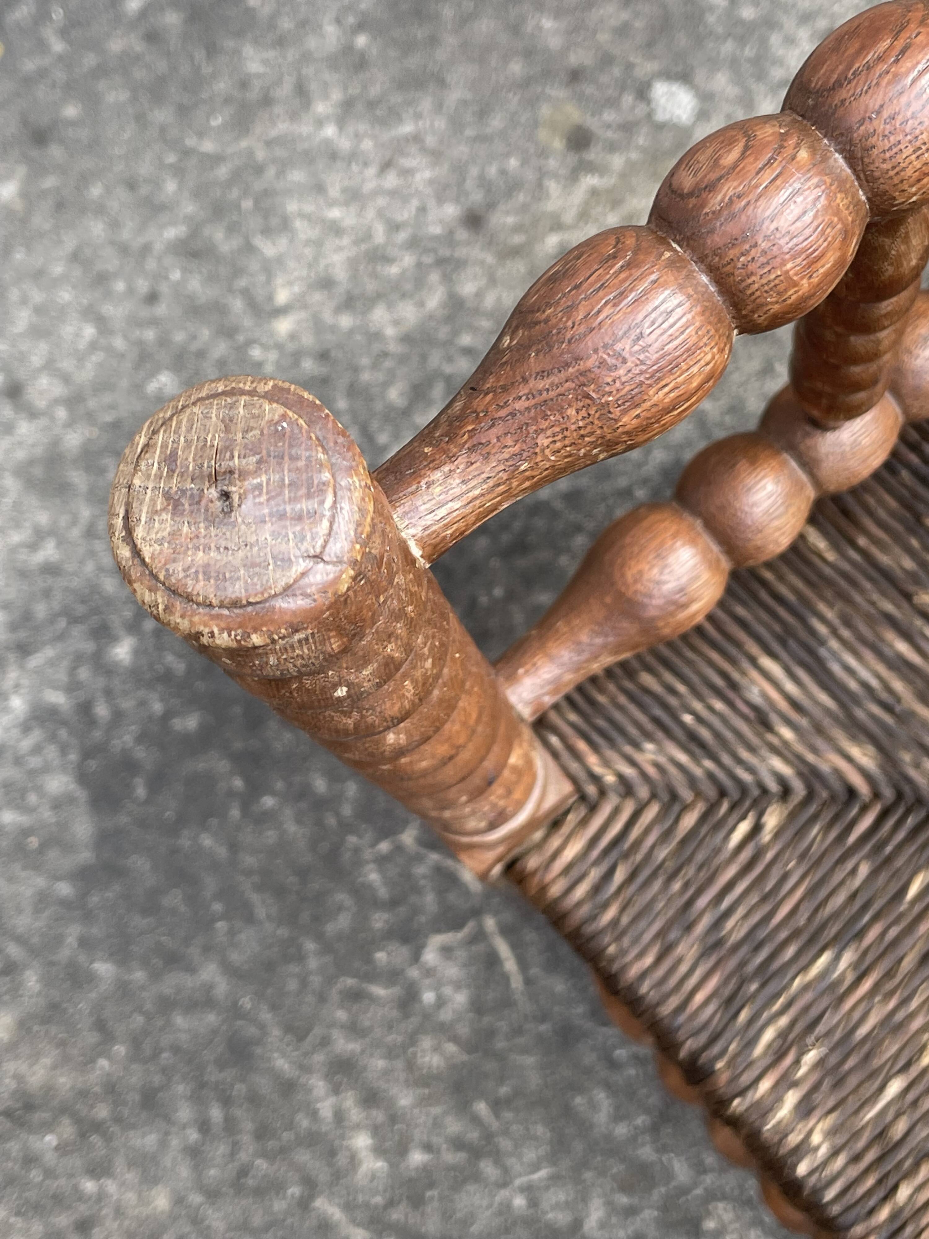 Antique Bobbin armchair with straw seat
