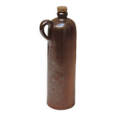 Old enamelled brown sandstone bottle with cork stopper